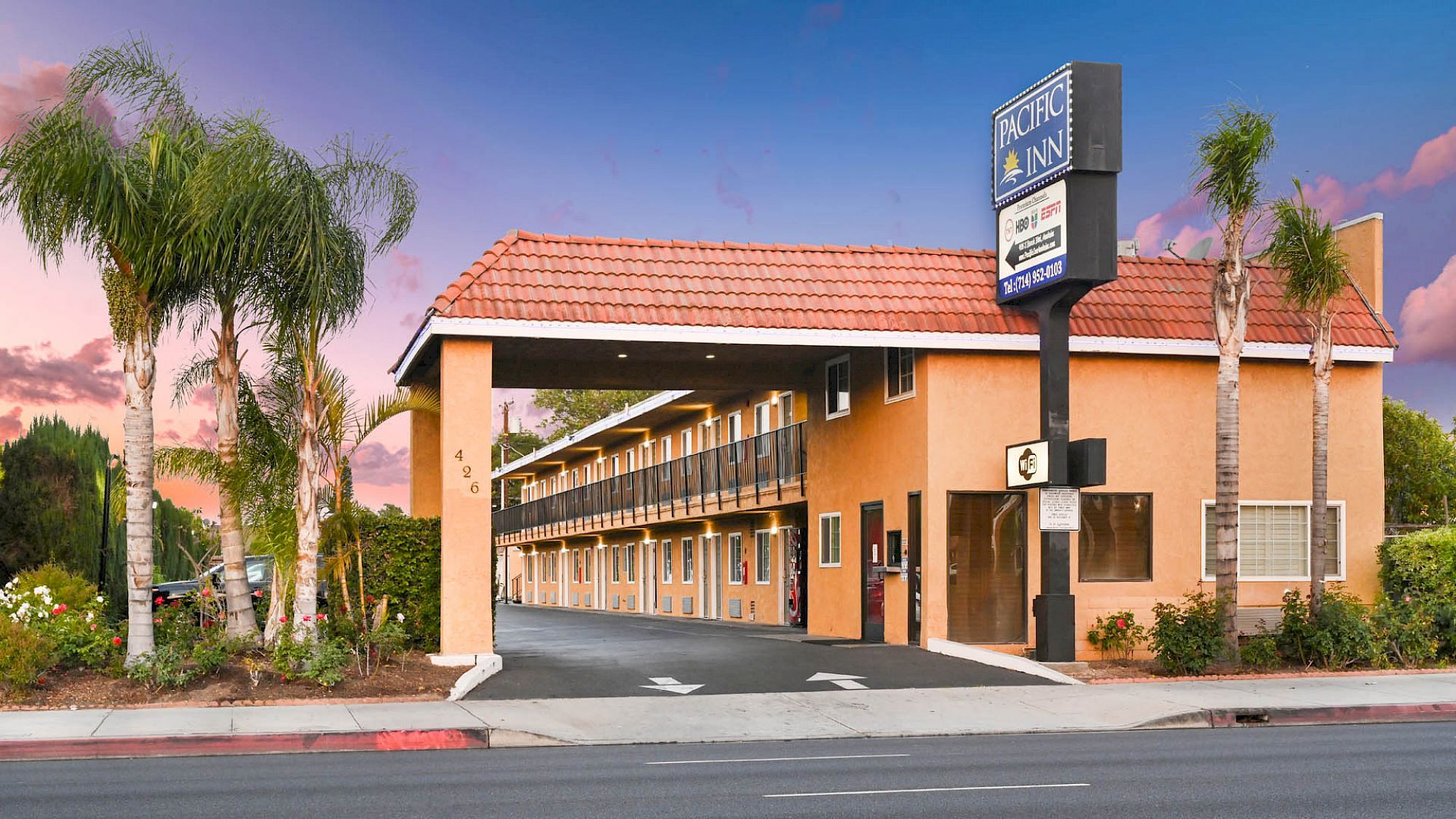 This image shows a two-story motel building with a 